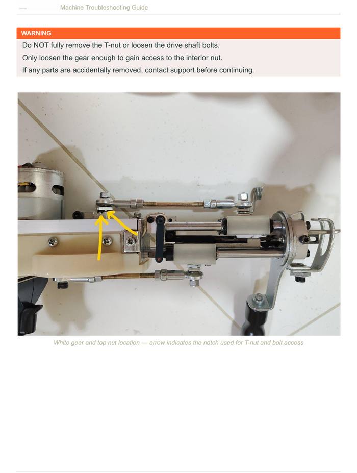 White gear and top nut location — arrow indicates the notch used for T-nut and bolt access